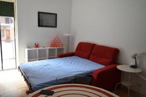 A bed or beds in a room at Zio Romano Apartment Rome - Vatican area