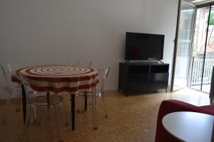 A television and/or entertainment centre at Zio Romano Apartment Rome - Vatican area