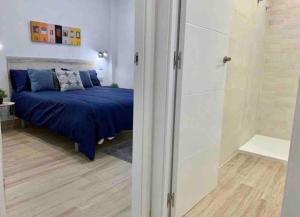 Łóżko lub łóżka w pokoju w obiekcie Apartamento 4 personas