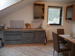 a kitchen with a sink and a counter top at Ferienwohnung BergTime in Weißenbach bei Liezen