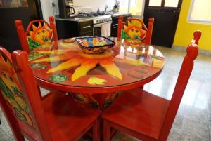 a dining room table with a bowl on top of it at Casa Sixto Osuna Boutique in Mazatlán