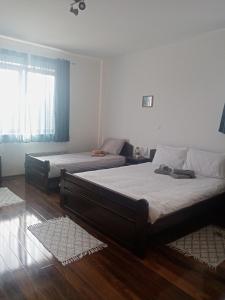Rúm í herbergi á Apartman Gakić 1
