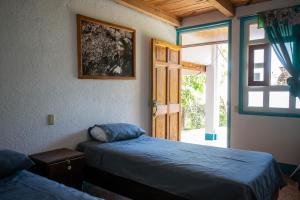 Postel nebo postele na pokoji v ubytování Hotel y Rest. las Cristalinas