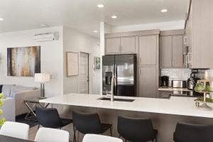 een keuken met een groot wit eiland in een kamer bij Family Reunion Fun #13 & #15 home in St. George