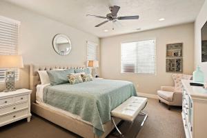 a bedroom with a bed and a ceiling fan at Four-Bedroom House in Santa Clara +51 photos