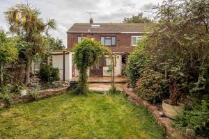 a brick house with a garden in front of it at Basildon 3 - 4 Bedroom Property - Essex in Basildon