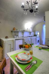 a kitchen with a table with a plate on it at Residenza Gatteschi in Pistoia