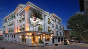 a large white building with a woman in a bath tub at Imagine Istanbul in Istanbul