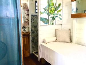 a small bedroom with a bed in a house at Kazasoley in Le Gosier