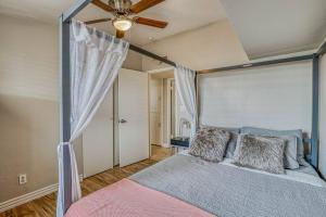 a bedroom with a bed and a ceiling fan at The Hummingbird Sunset Home, West Side in El Paso