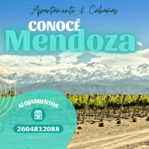 a sign for a vineyard with mountains in the background at CABAÑAS San Rafael - Con piscina - Alianza Compañía Inmobiliaria - Cuenta publicitaria in San Rafael