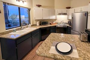 a kitchen with a sink and a counter top at Borrego Springs Retreat with Grill and Patio! in Borrego Springs