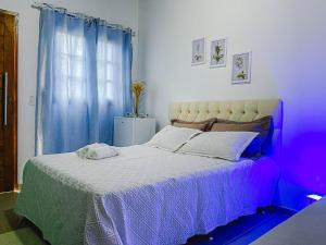Postel nebo postele na pokoji v ubytování News Hospedagem