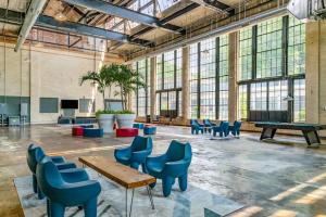 a large room with chairs and tables and windows at 5103 Peters New Industrial Loft on Lebanon Bike Trail in Maineville