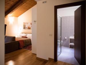 A bed or beds in a room at Residence Cà Beregana