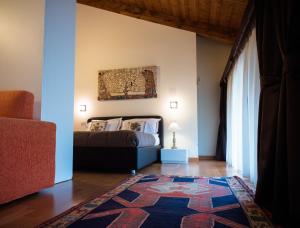 A bed or beds in a room at Residence Cà Beregana