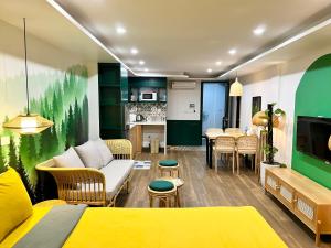 a living room with a couch and a table at Lubi House Homestay in Hanoi