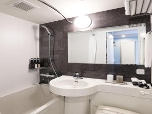 A bathroom at Henn na Hotel Premier Nagoya Fushimiekimae