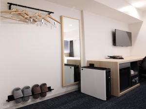 A kitchen or kitchenette at Henn na Hotel Premier Nagoya Fushimiekimae