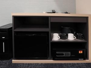 A kitchen or kitchenette at Henn na Hotel Premier Nagoya Fushimiekimae