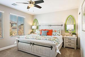 a bedroom with a bed and a ceiling fan at Zion Poolhouse home in Washington
