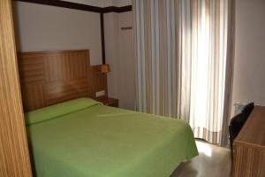 Cama o camas de una habitación en Hotel Apartamentos Don Juan I