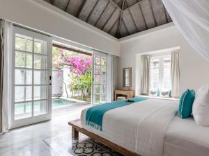 Kardia Resort Gili Trawangan A Pramana Experience客房内的一张或多张床位