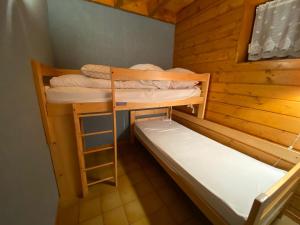 Posteľ alebo postele v izbe v ubytovaní Appartement calme avec Multi Pass à 3€/jour, proche du centre, des remontées et des activités d'été! - FR-1-693-20