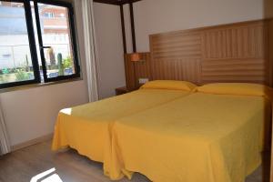 Cama o camas de una habitación en Hotel Apartamentos Don Juan I