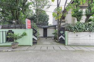 an entrance to a building with a sign on it at RedDoorz near RS Sari Asih Ciledug in Jakarta