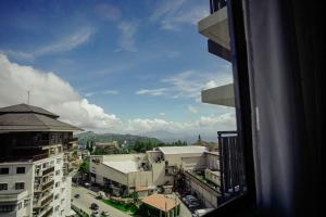 a view from a window of a city with buildings at Vicar Home by Serin East Tagaytay in Tagaytay