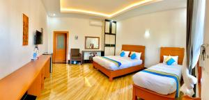 Postel nebo postele na pokoji v ubytování Nakasang Paradise Hotel