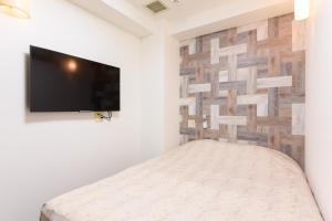 TV a/nebo společenská místnost v ubytování Otsuka Town Hotel