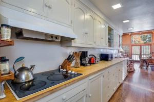 a kitchen with white cabinets and a stove top oven at Close to the Lake, Peaceful 5 Bedroom #343 in Tamarack