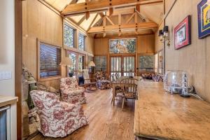 a large living room with a table and chairs at Close to the Lake, Peaceful 5 Bedroom #343 in Tamarack