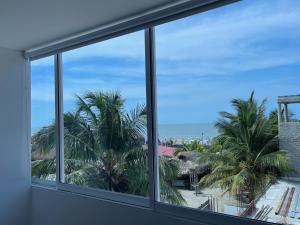 a view of the beach from a window at Hotel La Yarolina SAS in Cartagena de Indias