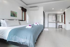 Postel nebo postele na pokoji v ubytování Ibiza Bungalows