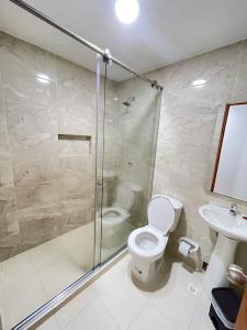 a bathroom with a shower and a toilet and a sink at Hotel La Yarolina SAS in Cartagena de Indias