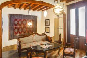 a living room with a couch and a table at "Son Cleda" House Boutique, adults only in Sineu