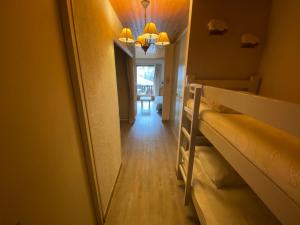 a hallway with two bunk beds in a room at Studio spacieux au pied des pistes avec casier à skis - FR-1-692-31 in La Chapelle-dʼAbondance