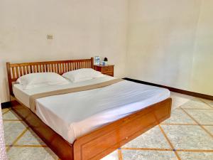 Postel nebo postele na pokoji v ubytování Nakasang Paradise Hotel