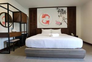 Postel nebo postele na pokoji v ubytování โรงแรมชลาลัย กระบี่ Chalalai Hotel Krabi