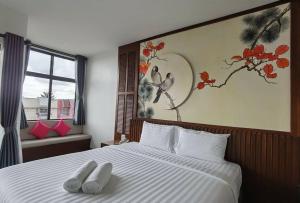 Postel nebo postele na pokoji v ubytování โรงแรมชลาลัย กระบี่ Chalalai Hotel Krabi