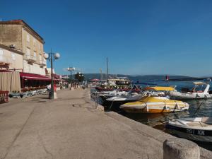 a group of boats are docked in a harbor at Seaside apartment in Krk