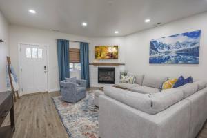 a living room with a couch and a fireplace at Brand new home minutes to Sandpoint and Schweitzer in Ponderay