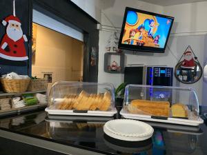 two trays of food sitting on top of a counter at Hotel Macon la Salle in Mâcon