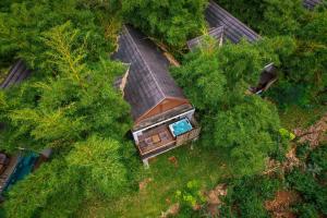 an overhead view of a house in the middle of trees at Morickap Resort in Vythiri