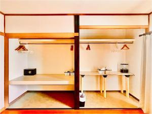 a room with two sets of bunk beds at Yellow House Niseko in Kutchan