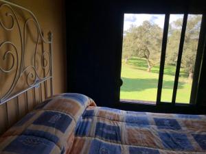 Posteľ alebo postele v izbe v ubytovaní Casa Rural Monterrey Aroche
