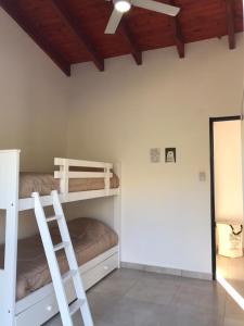 Postel nebo postele na pokoji v ubytování Mirador Merlo + 27 fotografií